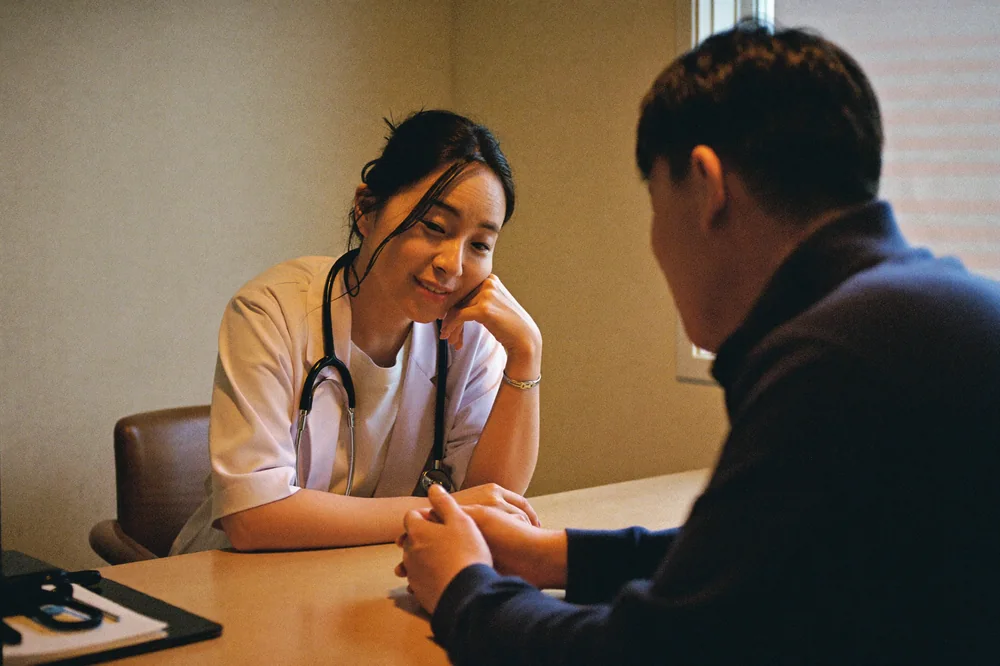 A patient in consultation with a licensed provider